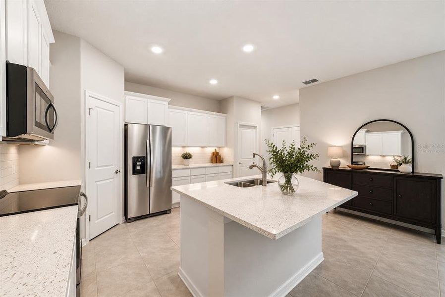Furnished interior view inside a new home in Towns at Woodsdale Villas, Wesley Chapel (Image 7).