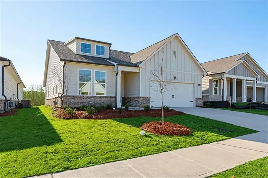 Front exterior of a new home in Kelly Preserve, Loganville, GA, highlighting curb appeal (Image 6).