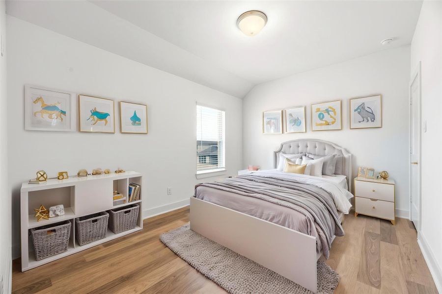 Generously sized and filled with natural light, this bedroom provides a comfortable, inviting atmosphere, perfect for a restful haven. Virtually staged.
