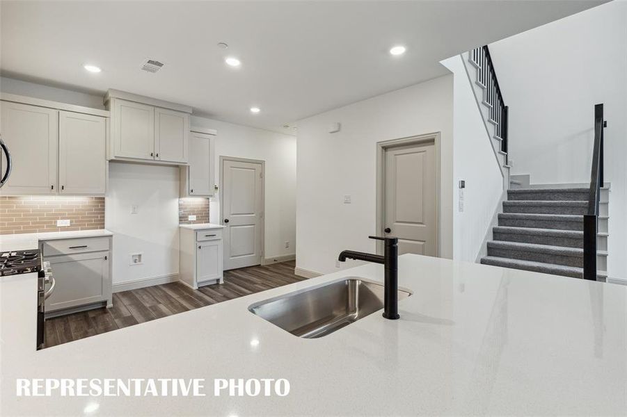 Open and inviting, this gorgeous kitchen is everything you have been searching for!  REPRESENTATIVE PHOTO