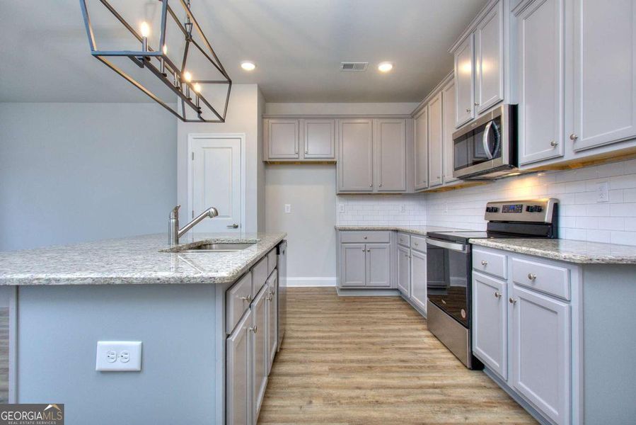 Furnished interior view inside a new home in Chimney Oaks Townhomes, Homer (Image 3).