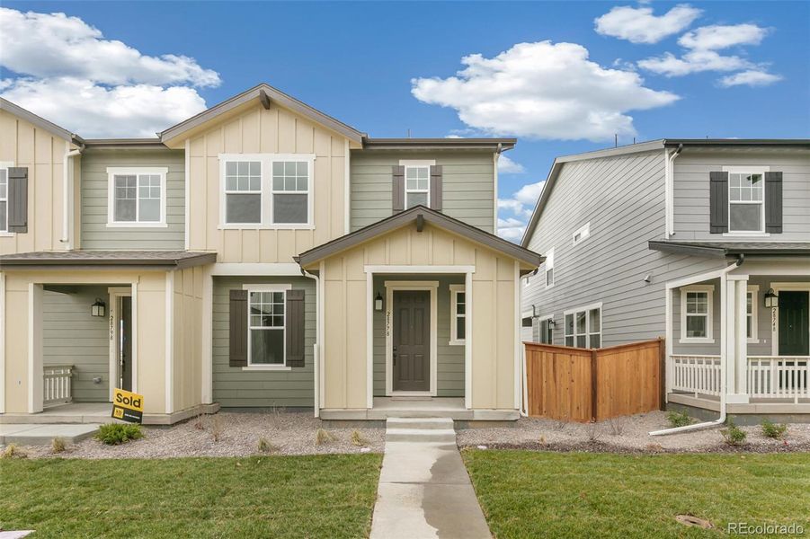 Front exterior of a new home in , Watkins, CO, highlighting curb appeal (Image 2).