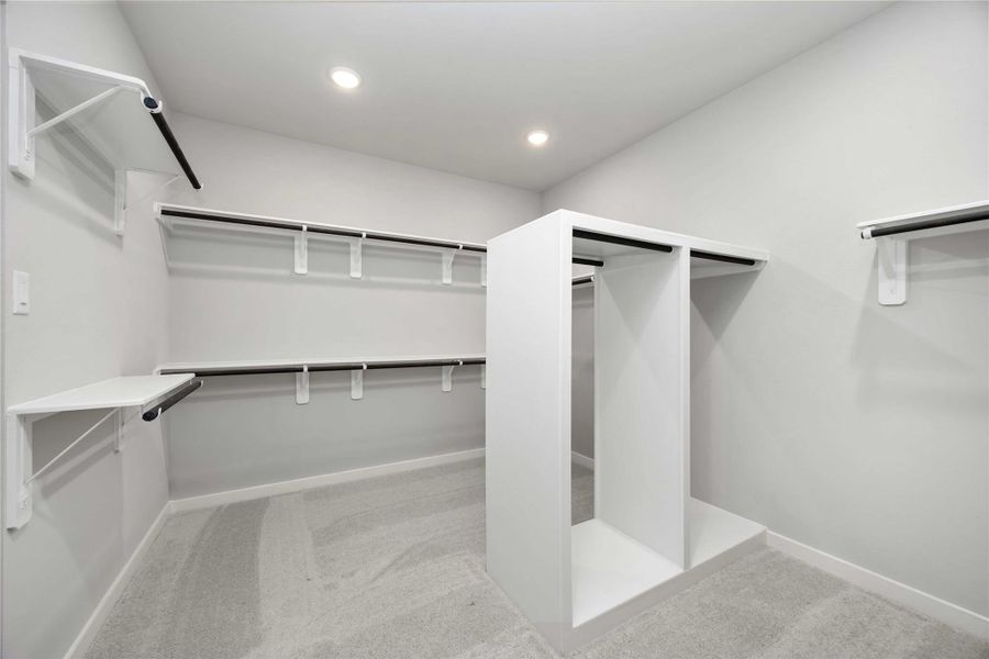 The luxurious owner's retreat is a private oasis with a spa-inspired bath and an extended walk-in closet.