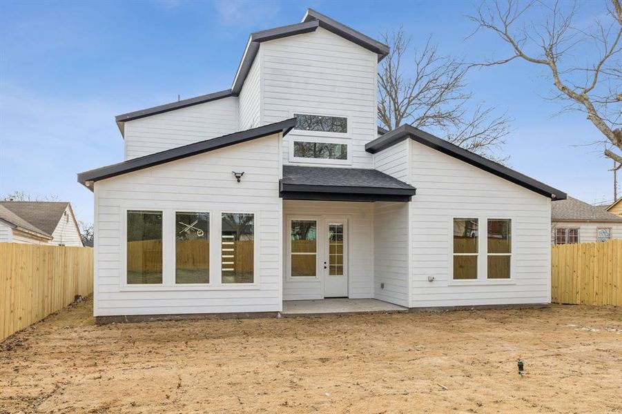 Rear view of house featuring a patio