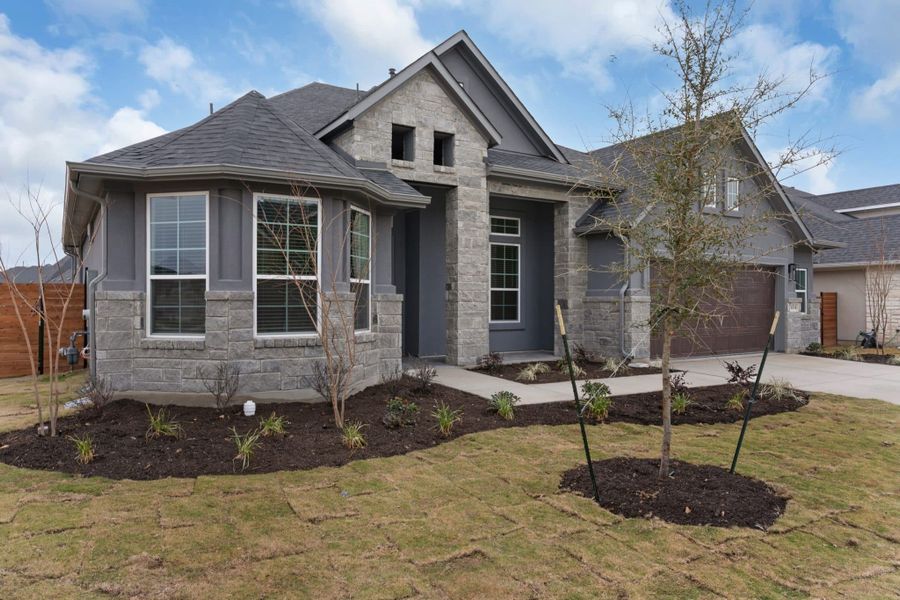 Front exterior of a new home in Broken Oak, Georgetown, TX, highlighting curb appeal (Image 2). Front exterior of a new home in Broken Oak, Georgetown, TX, highlighting curb appeal (Image 2).