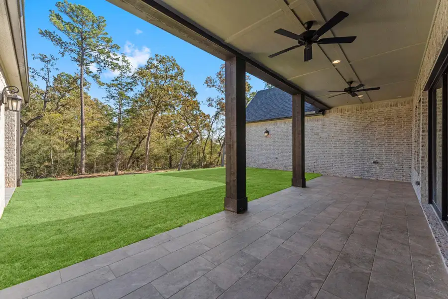 Exterior details and patio area of a home in Homestead Hill, New Waverly (Image 1).