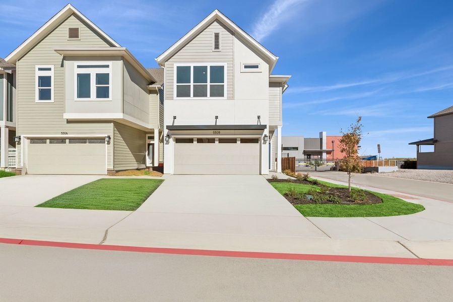 Front exterior of a new home in The Twilight at Goodnight Ranch, Austin, TX, highlighting curb appeal (Image 1). Front exterior of a new home in The Twilight at Goodnight Ranch, Austin, TX, highlighting curb appeal (Image 1).