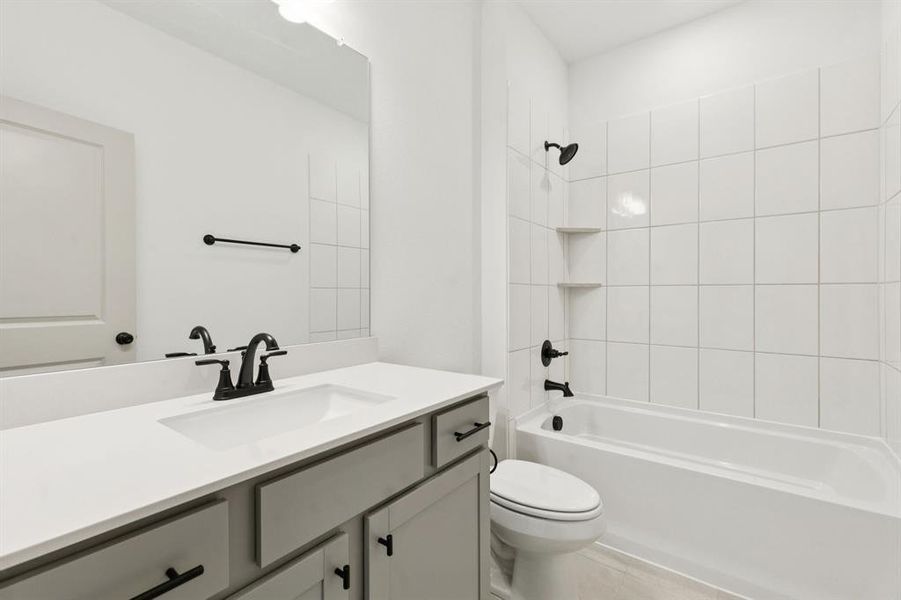 Guests will feel right at home in this beautifully finished guest bath.