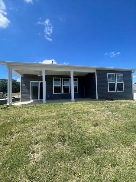 Exterior details and patio area of a home in Springwood Grove, Central (Image 20).