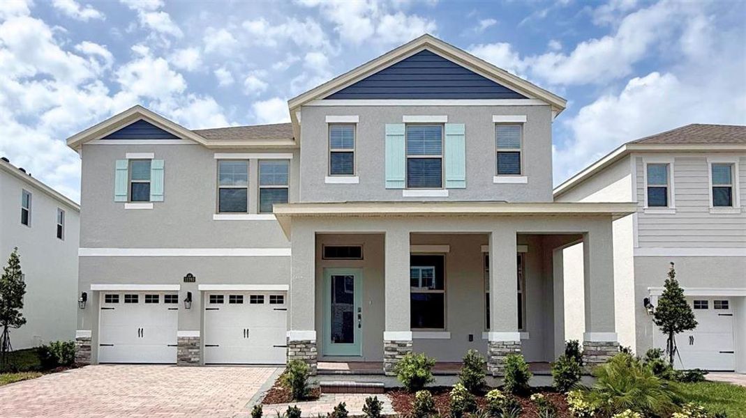 Front exterior of a new home in Waterleigh, Winter Garden, FL, highlighting curb appeal (Image 26). Front exterior of a new home in Waterleigh, Winter Garden, FL, highlighting curb appeal (Image 26).