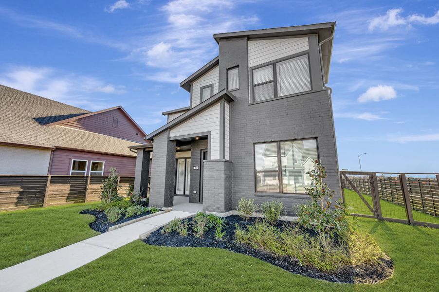 Front exterior of a new home in Indigo - Enclave Collection, Richmond, TX, highlighting curb appeal (Image 14). Front exterior of a new home in Indigo - Enclave Collection, Richmond, TX, highlighting curb appeal (Image 14).
