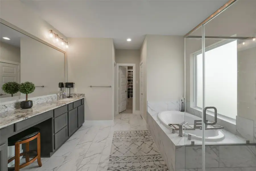 Expansive vanity space provides convenience and storage.