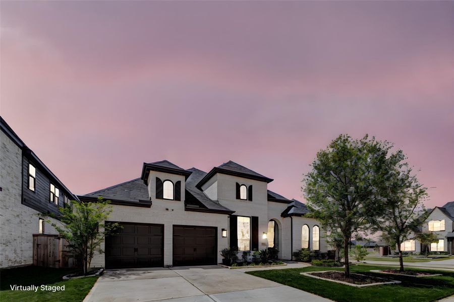 Front exterior of a new home in Cross Creek West, Fulshear, TX, highlighting curb appeal (Image 24). Front exterior of a new home in Cross Creek West, Fulshear, TX, highlighting curb appeal (Image 24).