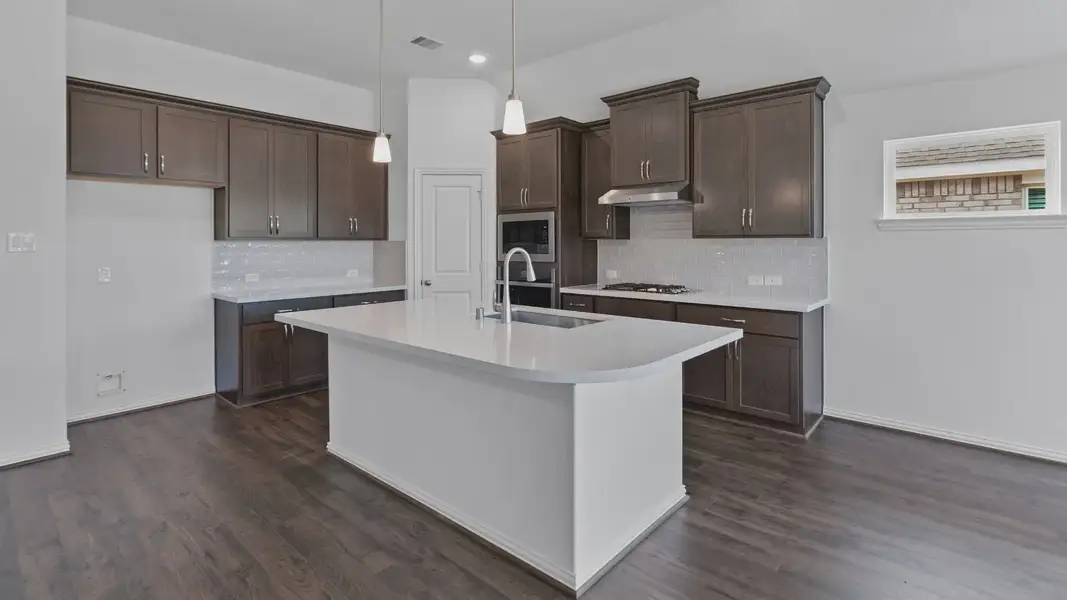 Furnished interior view inside a new home in Sunterra, Katy (Image 13).