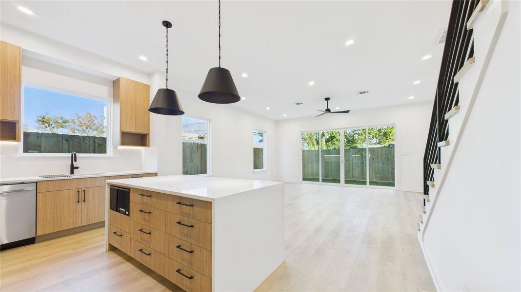 Kitchen waterfall island with microwave view