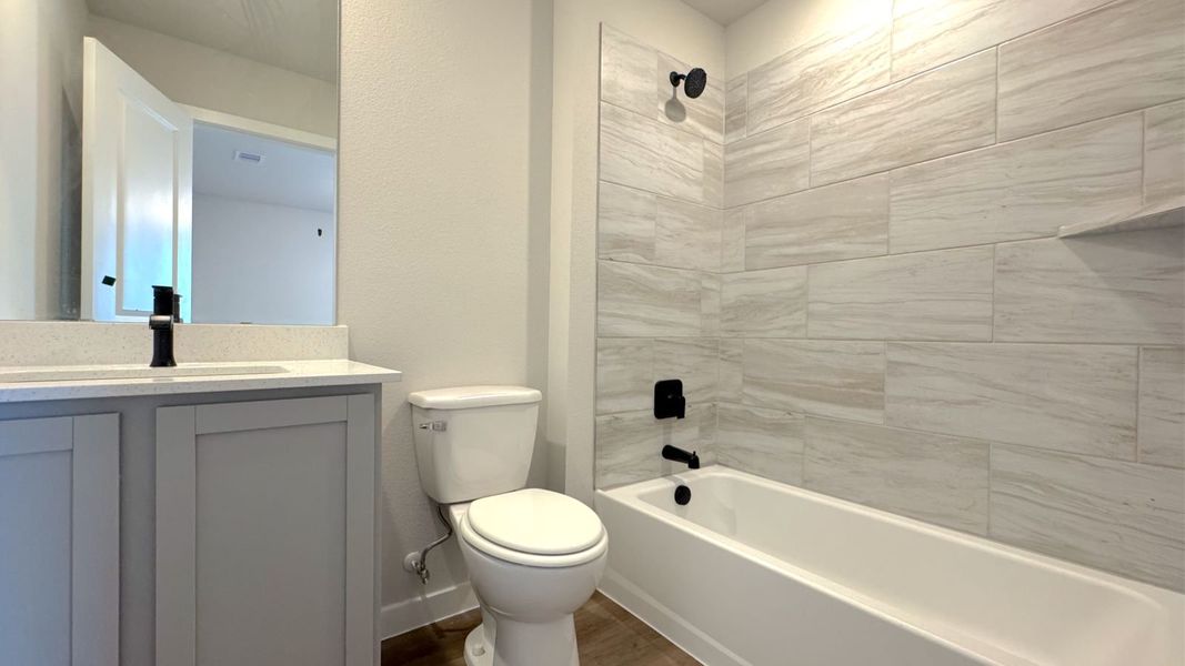Furnished interior view inside a new home in King's Landing, Corpus Christi (Image 9).
