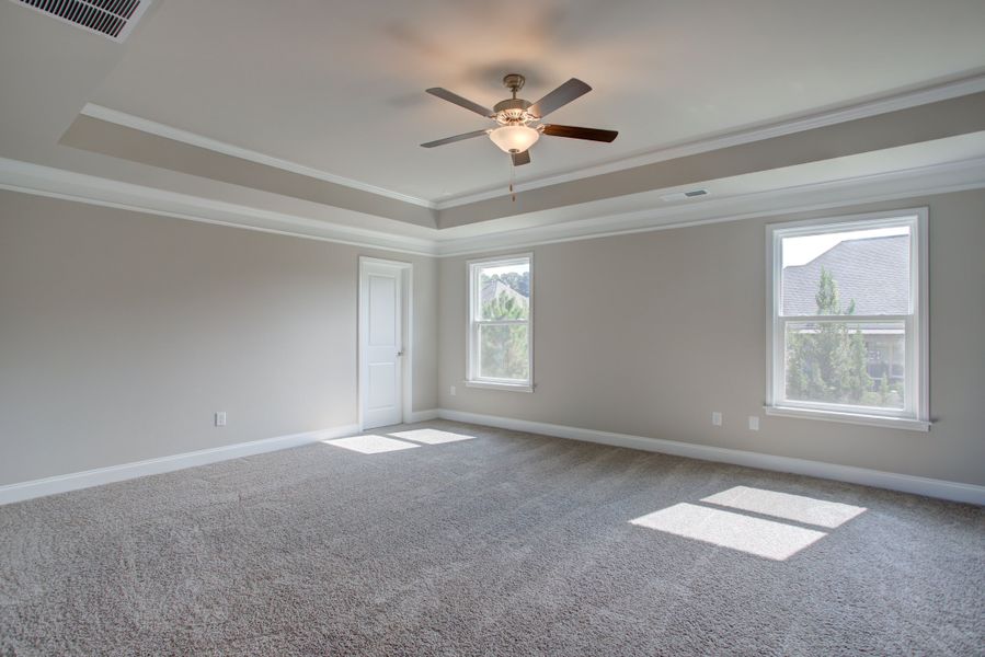 Spacious master bedroom with a private sitting area