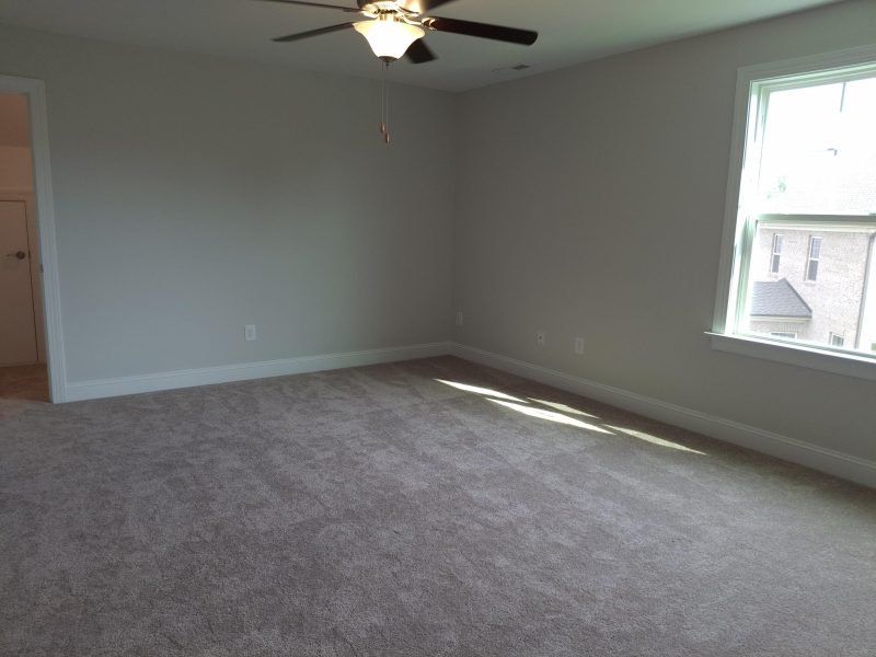 Spacious, unfurnished interior of a new home in Weybridge, Burlington (Image 58).