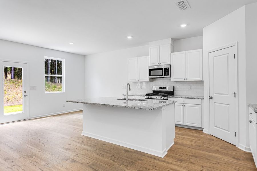 Representative furnished interior of a home built from the Avera by Taylor Morrison in Windance Lake, Loganville (Image 6).