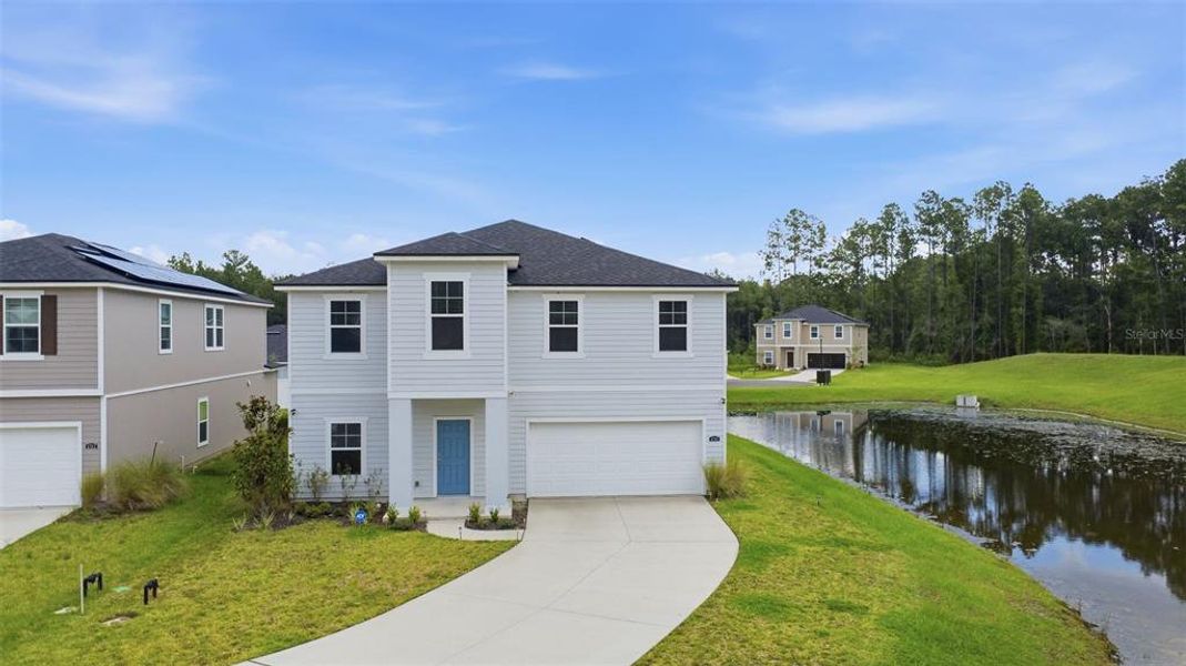 Front exterior of a new home in Dunns Crossing, Jacksonville, FL, highlighting curb appeal (Image 1). Front exterior of a new home in Dunns Crossing, Jacksonville, FL, highlighting curb appeal (Image 1).