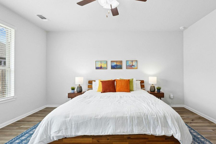 Located on the first floor, the primary suite has space for a seating area, too. Located on the first floor, the primary suite has space for a seating area, too.