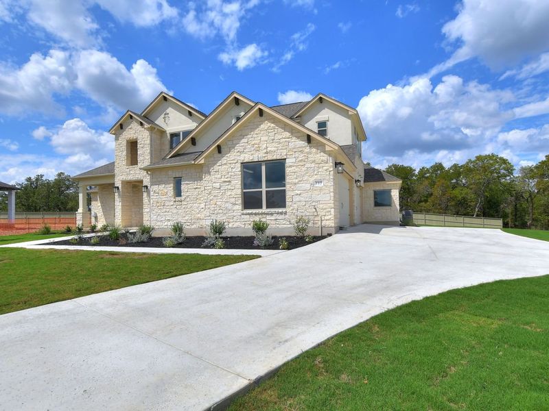 Representative exterior photo of a completed home built from the Madera II by Giddens Homes in Scofield Farms Estates, Georgetown, TX (Image 52).