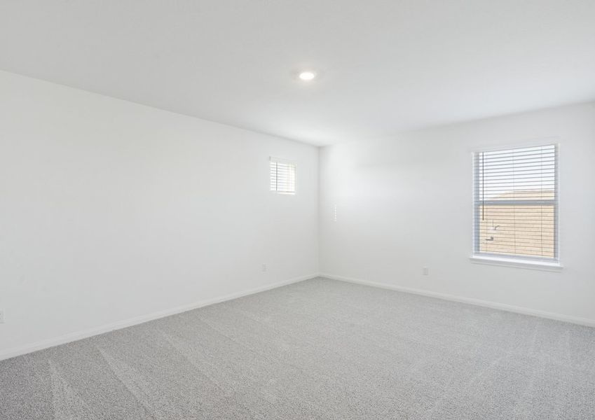 Upstairs game room with carpet flooring