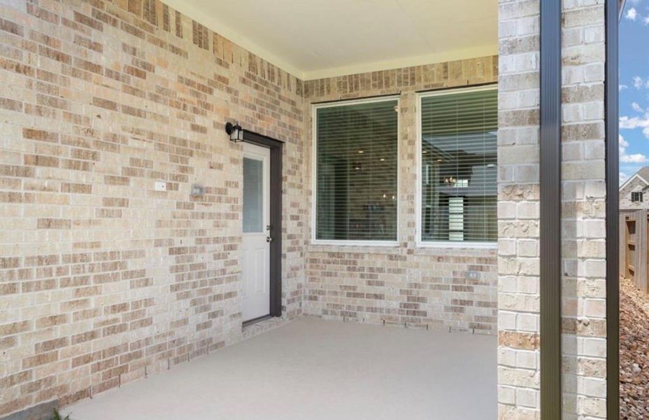 Exterior details and patio area of a home in Sunterra, Katy (Image 3).