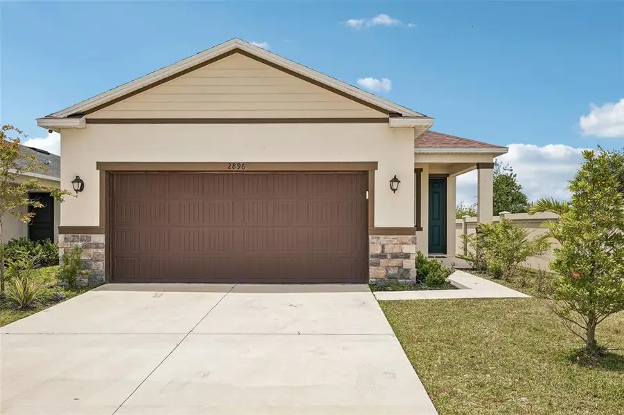Front exterior of a new home in , Palmetto, FL, highlighting curb appeal (Image 25). Front exterior of a new home in , Palmetto, FL, highlighting curb appeal (Image 25).
