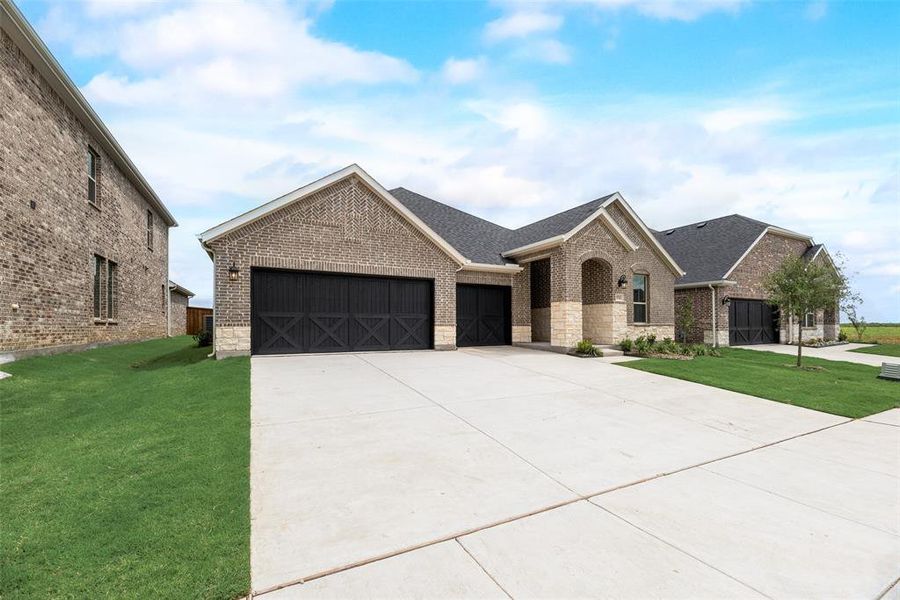 Front exterior of a new home in Sutton Fields, Celina, TX, highlighting curb appeal (Image 16).