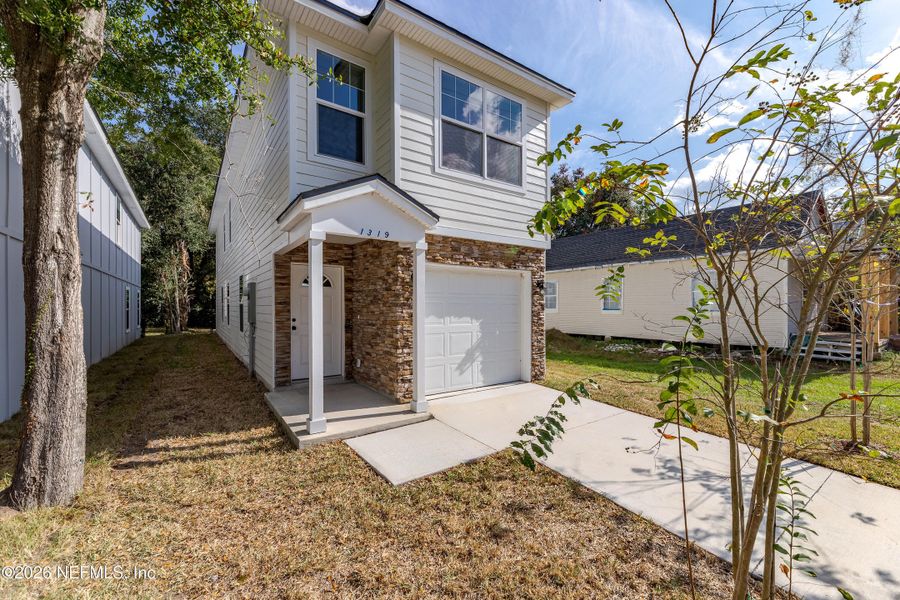Front exterior of a new home in , Jacksonville, FL, highlighting curb appeal (Image 2). Front exterior of a new home in , Jacksonville, FL, highlighting curb appeal (Image 2).