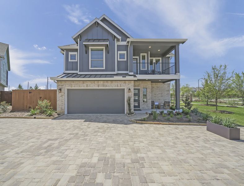 Representative exterior photo of a completed home built from the Springfield by Chesmar Homes in Sienna Courtyard, Missouri City, TX (Image 12).