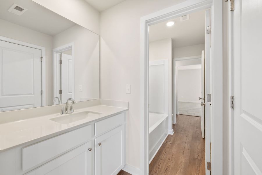 A bathroom with a sink and a shower. A bathroom with a sink and a shower.