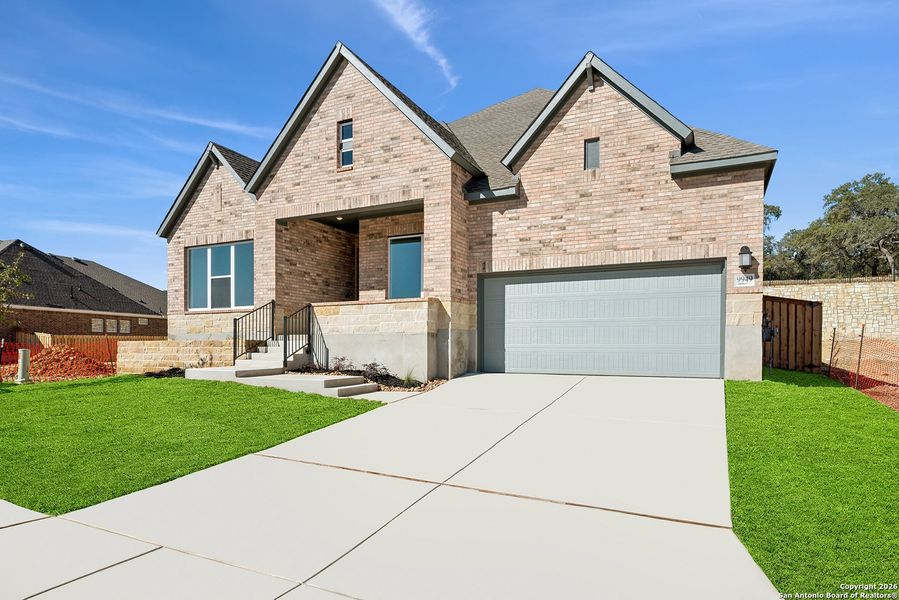 Front exterior of a new home in Windsong - Legacy Series, Boerne, TX, highlighting curb appeal (Image 2).