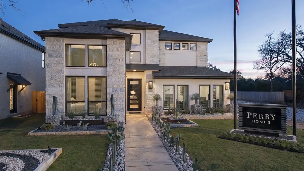 Front exterior of a new home in Parkside on the River West, Georgetown, TX, highlighting curb appeal (Image 2).