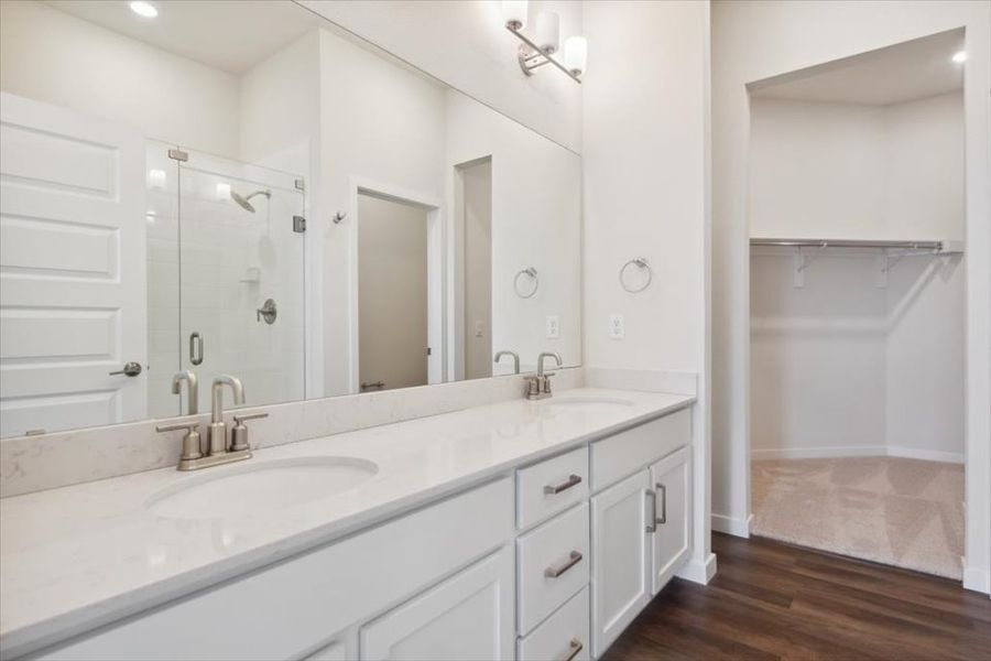 A bathroom with a large mirror. A bathroom with a large mirror.