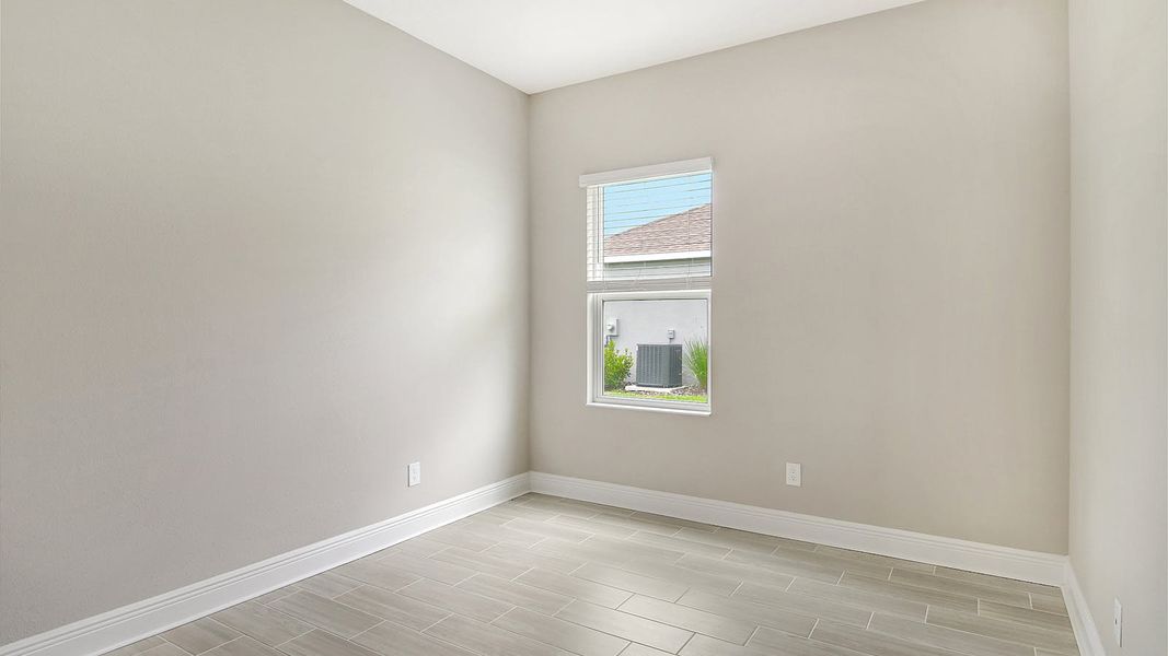 Spacious, unfurnished interior of a new home in Canoe Creek Real Estate and Homes for Sale in Parrish, FL - Neal Communities, Parrish (Image 12).