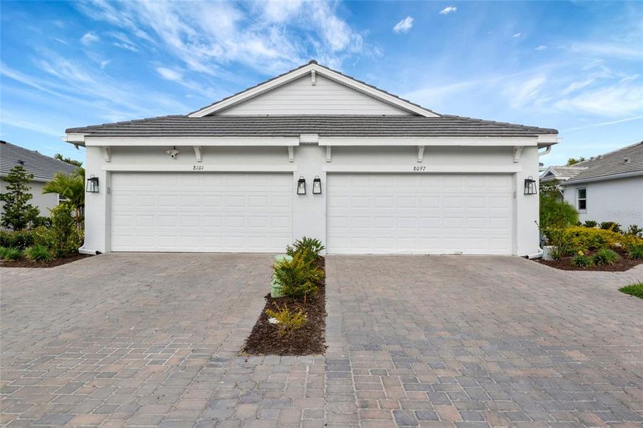 Front exterior of a new home in , Sarasota, FL, highlighting curb appeal (Image 27).