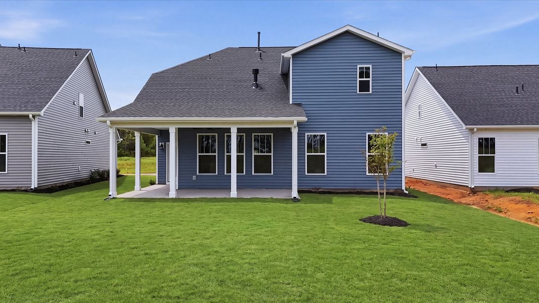 Warm and inviting outdoor living space with a covered rear porch and tasteful finishes