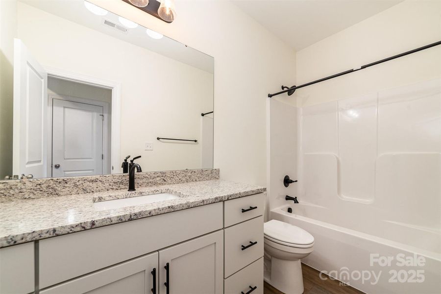 Bathroom with granite countertop