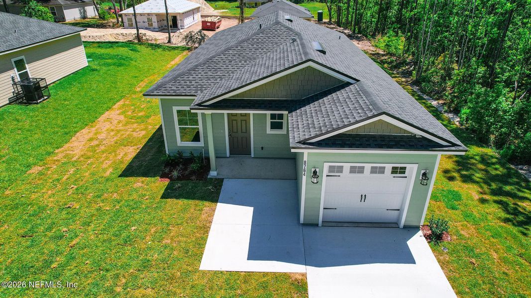 Front exterior of a new home in , Jacksonville, FL, highlighting curb appeal (Image 21).
