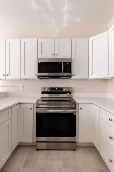 Furnished interior view inside a new home in , Tamarac (Image 12).