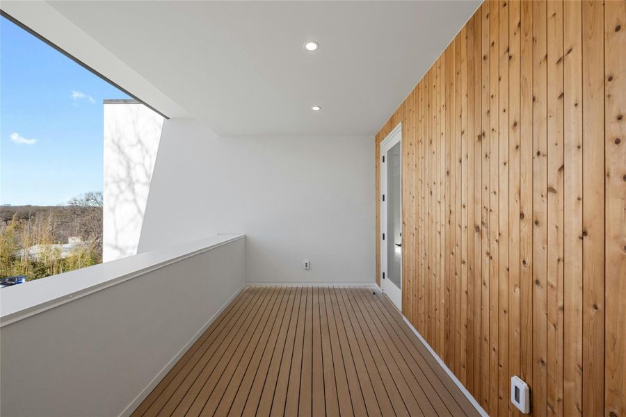 Upstairs balcony with vertical cedar accent wall