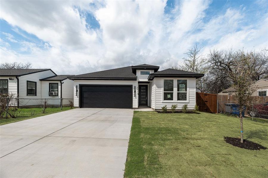 Front exterior of a new home in , Dallas, TX, highlighting curb appeal (Image 15).