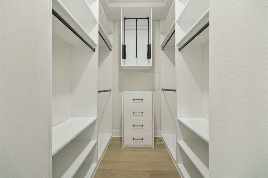Spacious dual primary closets offer ample storage and organization. Spacious dual primary closets offer ample storage and organization.