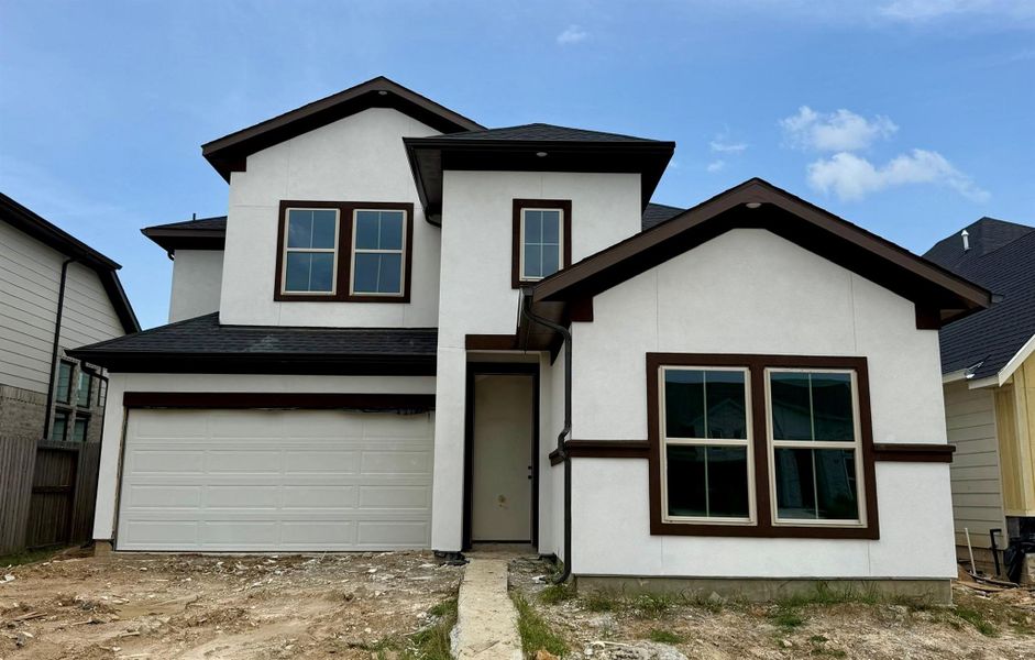 Front exterior of a new home in , Hockley, TX, highlighting curb appeal (Image 2).