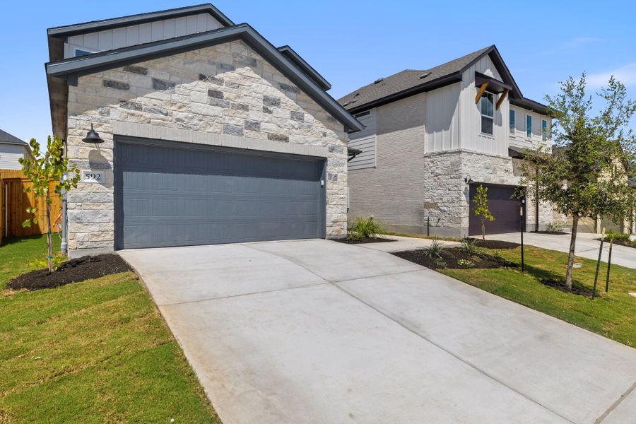 Front exterior of a new home in Heritage, Dripping Springs, TX, highlighting curb appeal (Image 27).