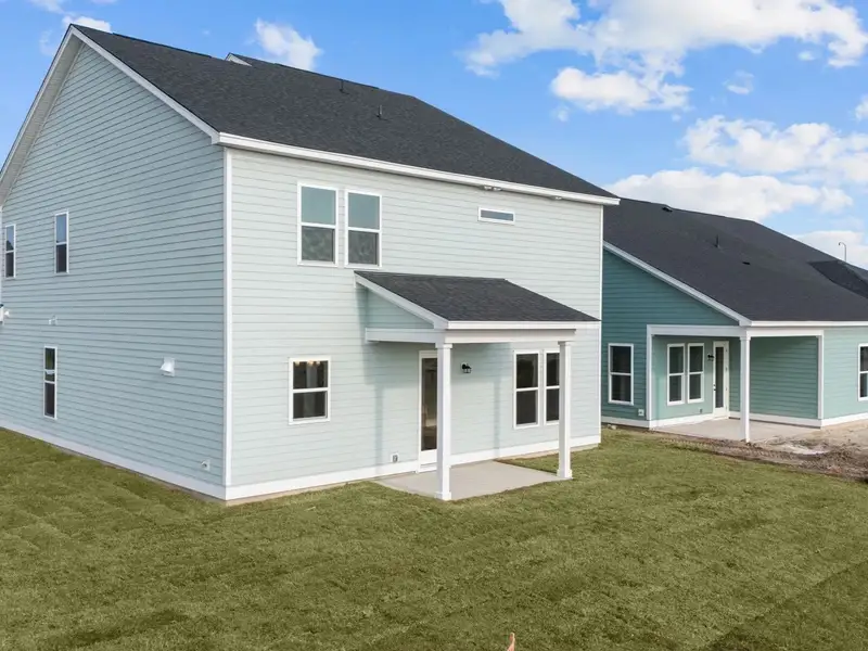 Exterior details and patio area of a home in Blue Heron Retreat, Little River (Image 4).