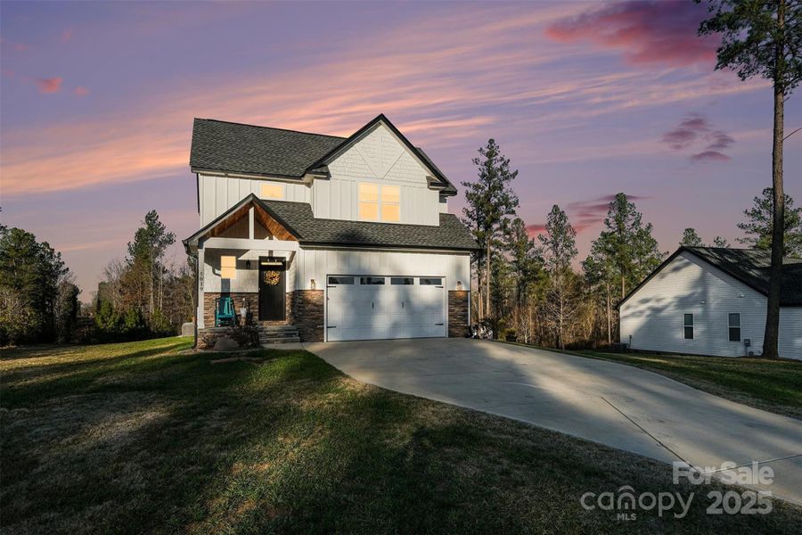 Front exterior of a new home in , Clover, SC, highlighting curb appeal (Image 22).