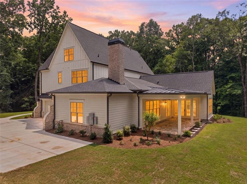 Front exterior of a new home in , Woodstock, GA, highlighting curb appeal (Image 24).